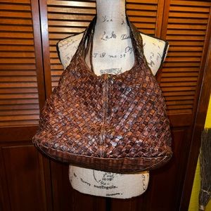 Brown leather cross hatch woven purse.